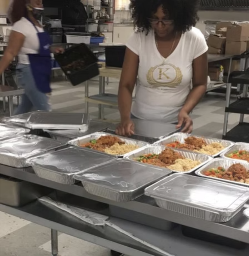 Volunteer with donated food